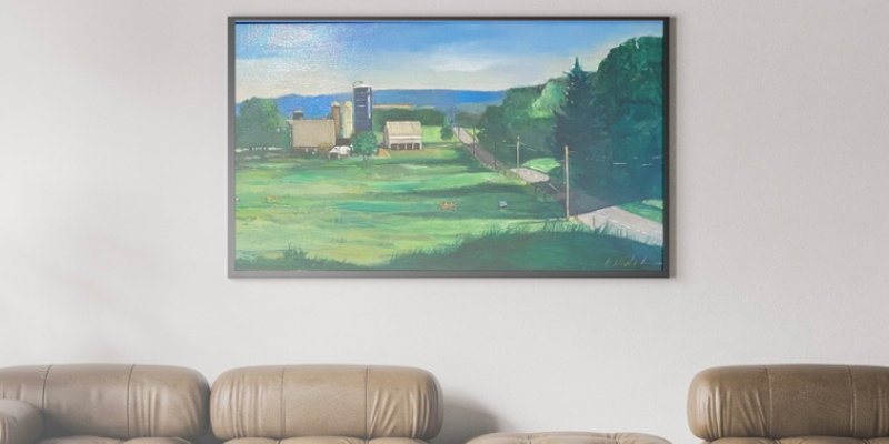 Arete Gallery Blog Post: Why should you have art in your home? Landscape painting hanging in living room.